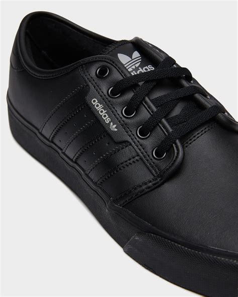 adidas black leather sneakers|solid black adidas shoes.